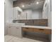 A modern bathroom features a stylish glass sink and wood toned drawers at 1 Costa Del Sol Ct, Henderson, NV 89011