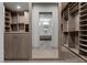 Hallway view between walk-in closets, showcasing ample storage and organization at 1 Costa Del Sol Ct, Henderson, NV 89011