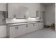 Organized garage with custom cabinets, a sink, and ample counter space for projects at 1 Costa Del Sol Ct, Henderson, NV 89011