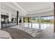 Open living area with high ceilings, marble floors, bar, and panoramic views at 1 Costa Del Sol Ct, Henderson, NV 89011