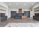 Sleek modern kitchen features a large island, gas cooktop, stainless steel appliances, and ample cabinet space at 1 Costa Del Sol Ct, Henderson, NV 89011