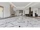 A modern living room boasts a fireplace, bar area, and sleek marble floors at 1 Costa Del Sol Ct, Henderson, NV 89011