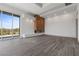 An elegant living room features wood floors, a fireplace and large windows at 1 Costa Del Sol Ct, Henderson, NV 89011