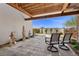 Charming outdoor patio with elegant statues, seating, and a view of the landscape at 1 Costa Del Sol Ct, Henderson, NV 89011