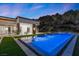 Stunning backyard features a modern pool with elegant water features and landscaped surroundings at 1 Costa Del Sol Ct, Henderson, NV 89011