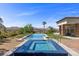 Luxury backyard features a large pool and hot tub with mountain views at 1 Costa Del Sol Ct, Henderson, NV 89011