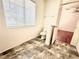 Bathroom featuring tile flooring, toilet, and window at 10381 Poker Alice Ct, Las Vegas, NV 89129