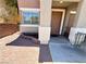 Inviting front entrance with a well-maintained walkway, landscaping, and covered porch at 10381 Poker Alice Ct, Las Vegas, NV 89129