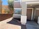 Charming front entrance with a covered porch, pretty landscaping, and convenient access at 10381 Poker Alice Ct, Las Vegas, NV 89129