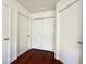 Hallway featuring multiple doors and closet space at 10381 Poker Alice Ct, Las Vegas, NV 89129