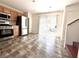 Bright eat-in kitchen with stainless appliances, wood cabinets, and access to backyard patio at 10381 Poker Alice Ct, Las Vegas, NV 89129
