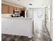 Open kitchen featuring wood cabinets, a stainless steel microwave, and views to the backyard patio at 10381 Poker Alice Ct, Las Vegas, NV 89129