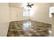 Bright living room with tile flooring, ceiling fan, and great natural light at 10381 Poker Alice Ct, Las Vegas, NV 89129
