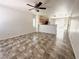 Open-concept living area with tile flooring, neutral walls, flowing seamlessly to kitchen at 10381 Poker Alice Ct, Las Vegas, NV 89129