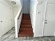 Stairway with wood stairs and modern tile flooring in the entryway at 10381 Poker Alice Ct, Las Vegas, NV 89129