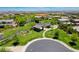 Beautiful aerial view of the community park featuring covered picnic area, walking paths, and lush landscaping at 10433 Ember Rose Ave, Las Vegas, NV 89135