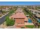 Bird's-eye view of a home with a pool, and well-maintained yard surrounded by lush trees and neighboring houses at 10433 Ember Rose Ave, Las Vegas, NV 89135