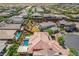 Expansive aerial view of a residential neighborhood showcasing a home with a private pool at 10433 Ember Rose Ave, Las Vegas, NV 89135