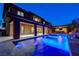 Inviting backyard featuring a pool, covered outdoor kitchen, and seamless transition to the home's interior at 10433 Ember Rose Ave, Las Vegas, NV 89135