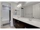 Bathroom with dual sinks, a shower-tub combo, and modern fixtures at 10433 Ember Rose Ave, Las Vegas, NV 89135
