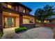 Warm and inviting home entrance with a covered porch, stylish front door, and paver walkway at 10433 Ember Rose Ave, Las Vegas, NV 89135