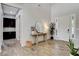 Inviting entryway with wood floors, a modern console table, and ample natural light at 10433 Ember Rose Ave, Las Vegas, NV 89135