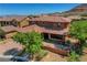 Elegant two-story home featuring a well-manicured front yard and a welcoming entrance with a beautiful walkway at 10433 Ember Rose Ave, Las Vegas, NV 89135