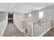 Upstairs hallway with white banister, recessed lighting, and views of the downstairs at 10433 Ember Rose Ave, Las Vegas, NV 89135
