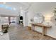 Bright living room with high ceilings, wood floors, and sliding glass doors to outdoor space at 10433 Ember Rose Ave, Las Vegas, NV 89135