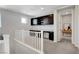 Well-lit loft area with built-in desks, cabinets, and a versatile workspace at 10433 Ember Rose Ave, Las Vegas, NV 89135