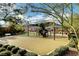 Picturesque playground with diverse play equipment, surrounded by greenery, offering a delightful outdoor experience at 10433 Ember Rose Ave, Las Vegas, NV 89135