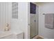 Bathroom with soaking tub and glass block window, complemented by a walk-in shower at 10720 Bennington Ct, Las Vegas, NV 89134