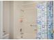 Bathroom features a tub and shower combination with a colorful shower curtain at 10720 Bennington Ct, Las Vegas, NV 89134