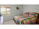 Cozy bedroom with a colorful quilt, shuttered window and classic decor at 10720 Bennington Ct, Las Vegas, NV 89134