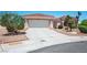 Well-maintained home with a tile roof, concrete driveway, and desert landscaping enhancing curb appeal at 10720 Bennington Ct, Las Vegas, NV 89134