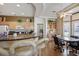 Open kitchen featuring a breakfast bar, stainless appliances, and seamless flow to the dining area at 10720 Bennington Ct, Las Vegas, NV 89134