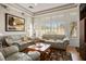 Spacious living room with neutral walls, shuttered windows, and comfortable furniture at 10720 Bennington Ct, Las Vegas, NV 89134
