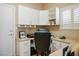 Office space with built-in cabinetry, a large desk, and bright natural light at 10720 Bennington Ct, Las Vegas, NV 89134
