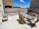 Patio area with dining set, offering a relaxing space for outdoor gatherings at 10968 Geyser Peak St, Henderson, NV 89052