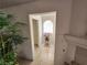 Warm entryway with neutral tile flooring, natural light, and decorative plants at 10968 Geyser Peak St, Henderson, NV 89052