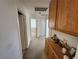 Hallway featuring carpeted floors and a storage cabinet at 10968 Geyser Peak St, Henderson, NV 89052