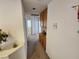 Hallway with cabinets, wall decor, and doorway views to other rooms at 10968 Geyser Peak St, Henderson, NV 89052