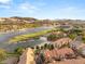 Breathtaking aerial view of lakefront homes, golf course, and mountain views in a picturesque community at 11 Via Vita Bella, Henderson, NV 89011