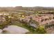Stunning aerial view showcasing the community's well-manicured lawns, pool, landscaping, and Mediterranean-style architecture at 11 Via Vita Bella, Henderson, NV 89011