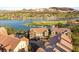 Stunning aerial view showcasing waterfront property, lush landscaping, and community amenities at 11 Via Vita Bella, Henderson, NV 89011