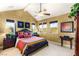 Spacious bedroom with high ceilings, a ceiling fan, a large bed, and three large windows at 11 Via Vita Bella, Henderson, NV 89011