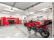 Spacious garage with epoxy floors, ample storage, and room for multiple vehicles at 11 Via Vita Bella, Henderson, NV 89011