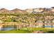 Scenic golf course by the lake with luxury homes in the background and mountains beyond at 11 Via Vita Bella, Henderson, NV 89011