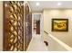 Hallway with decorative wooden trim and a view into a well-decorated room at 11 Via Vita Bella, Henderson, NV 89011