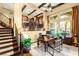Spacious home office featuring hardwood floors, beamed ceilings, and abundant natural light at 11 Via Vita Bella, Henderson, NV 89011